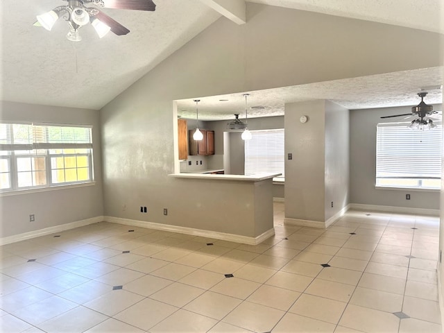 unfurnished living room featuring light tile patterned floors, a textured ceiling, ceiling fan, and vaulted ceiling with beams