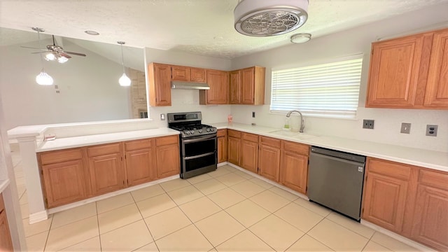 kitchen featuring appliances with stainless steel finishes, vaulted ceiling, sink, pendant lighting, and ceiling fan