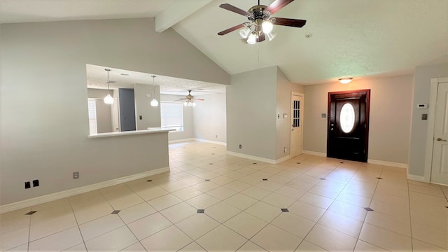 foyer entrance featuring high vaulted ceiling, ceiling fan, light tile patterned floors, and beam ceiling