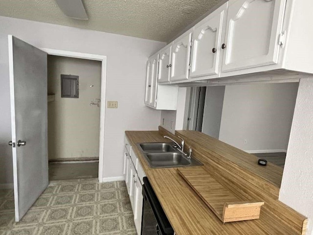 7206 Elwood Ct Unit A4, Corpus Christi, TX 78413 - kitchen featuring a sink, dishwasher, white cabinetry, baseboards, and light flooring
