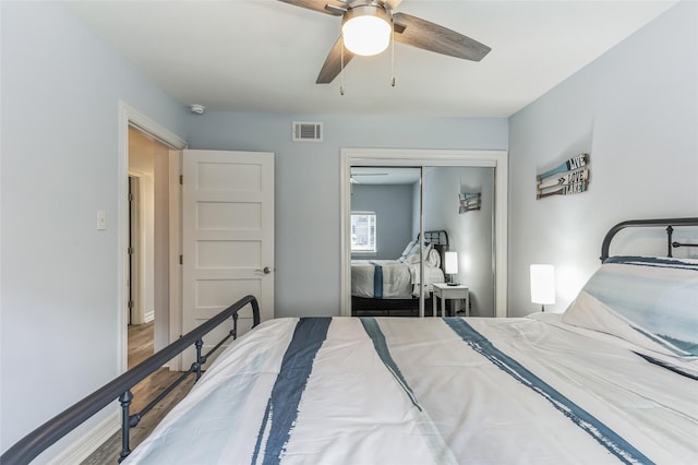 bedroom featuring ceiling fan, a closet, and visible vents