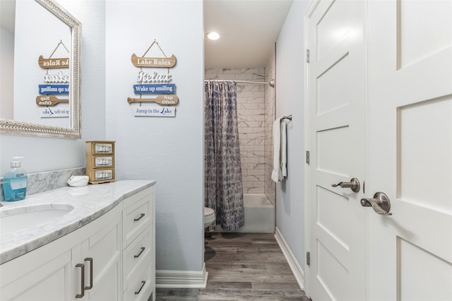 full bathroom with shower / bathtub combination with curtain, toilet, vanity, wood finished floors, and baseboards