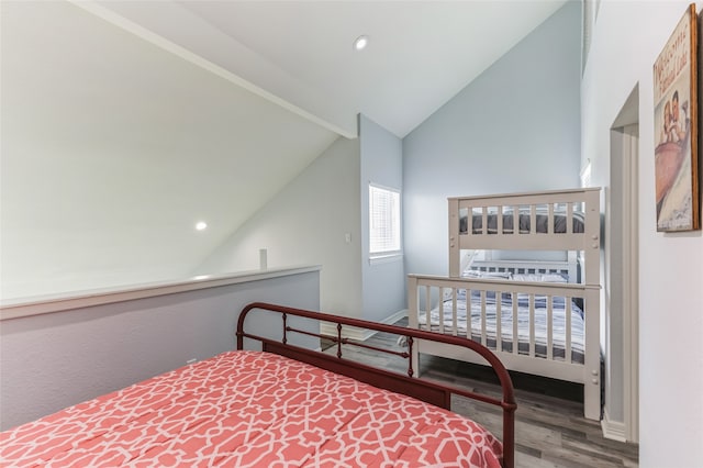 bedroom featuring lofted ceiling and hardwood / wood-style flooring