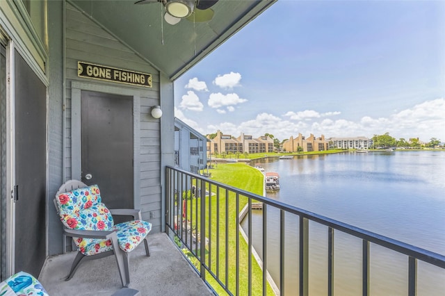 balcony with a ceiling fan and a water view