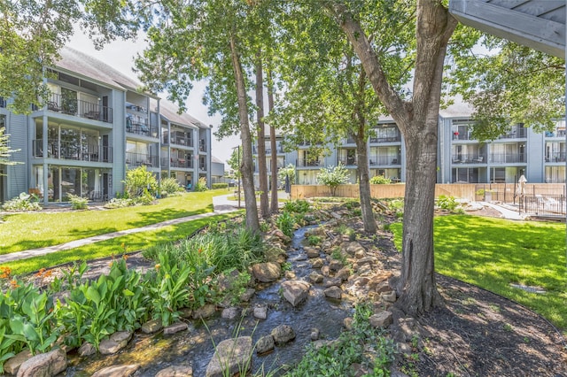 view of home's community featuring a yard