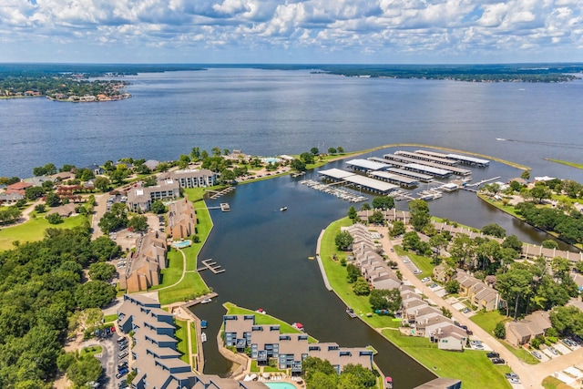 drone / aerial view featuring a water view and a residential view