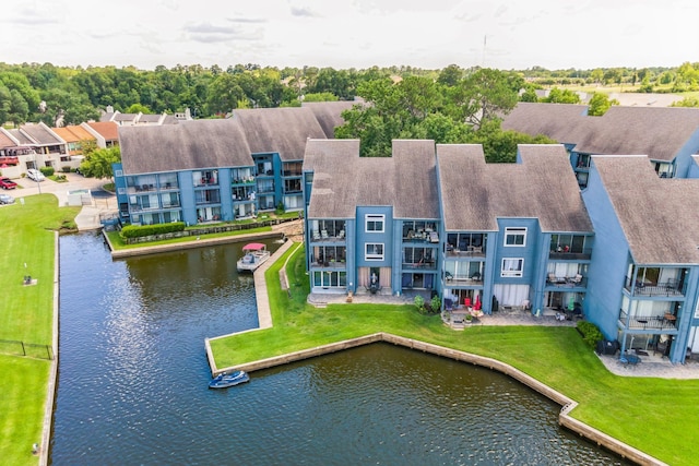 birds eye view of property with a water view