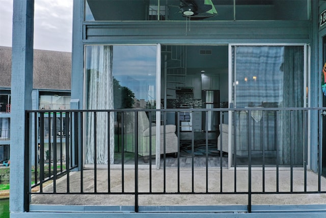 view of gate with ceiling fan