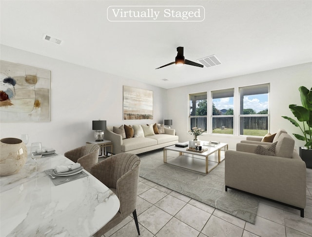 living room with light tile patterned floors and ceiling fan