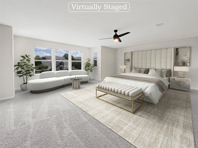 bedroom with ceiling fan and carpet flooring