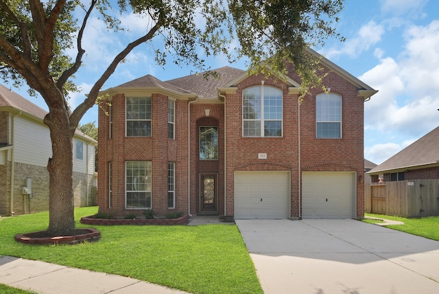 view of front of house with a garage and a front lawn