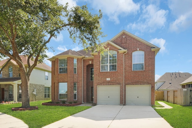 view of front of property with a front lawn and a garage