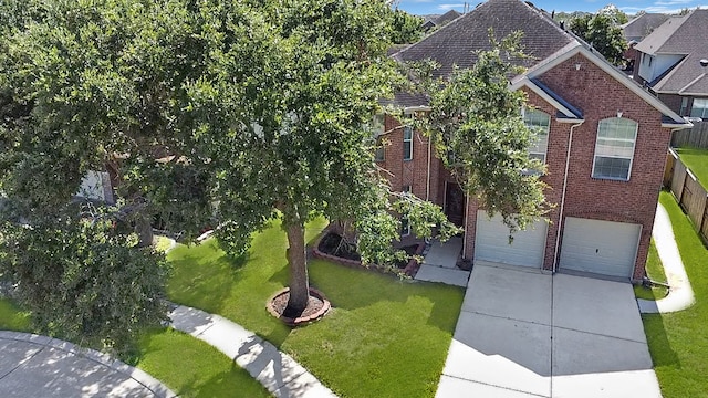 exterior space featuring a garage and a front lawn