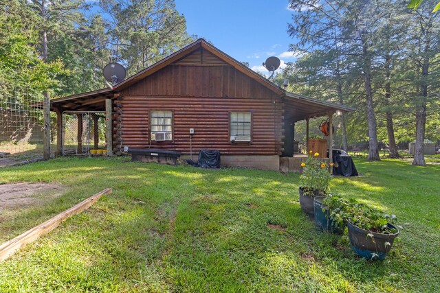 view of property exterior featuring a lawn