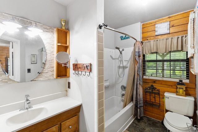 full bathroom featuring tile flooring, toilet, shower / bath combo with shower curtain, and vanity