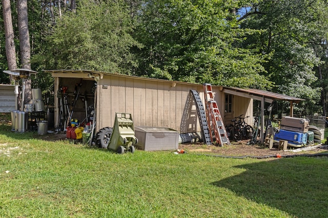 view of shed / structure with a lawn