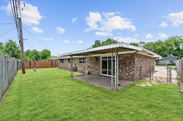 back of property featuring a lawn and a patio area