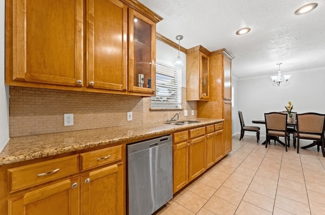 kitchen featuring dishwasher, backsplash, pendant lighting, sink, and ornamental molding