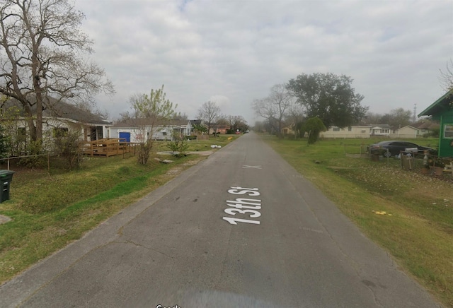 801 13th St, Port Arthur, TX 77640 - view of asphalt road featuring a residential view