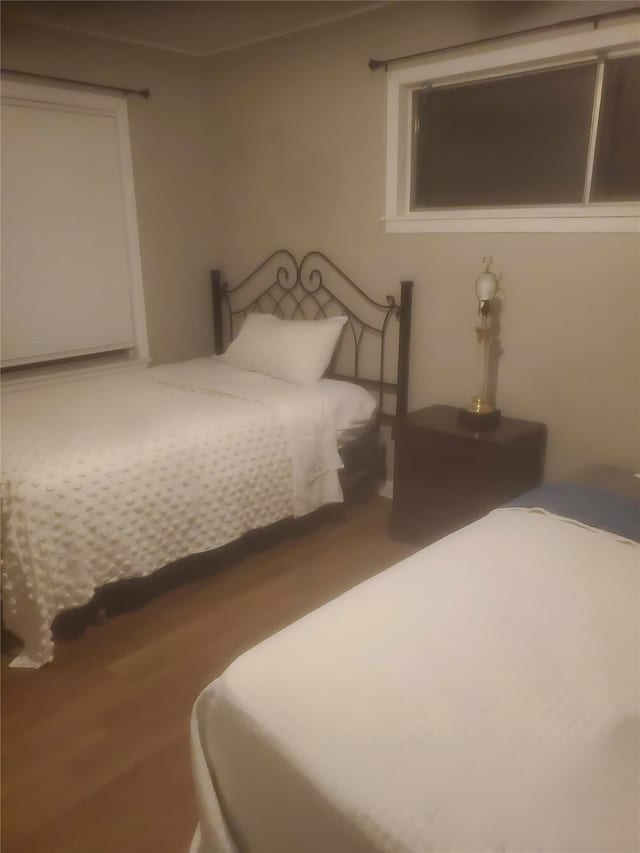 bedroom featuring wood-type flooring