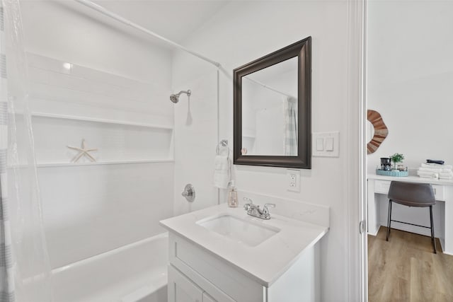 bathroom with shower / bath combo with shower curtain, vanity, and hardwood / wood-style floors