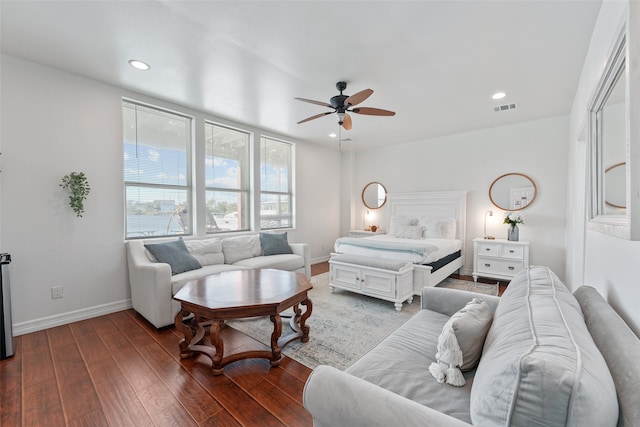 living room featuring ceiling fan and hardwood / wood-style floors