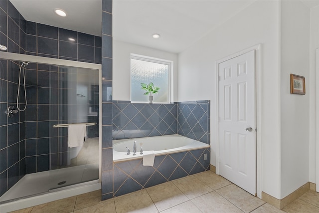 bathroom featuring plus walk in shower and tile patterned floors