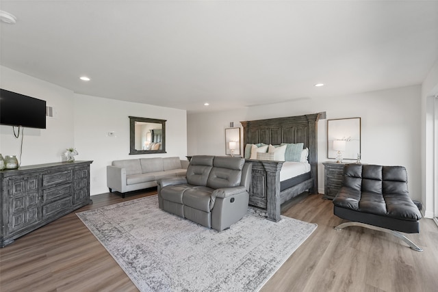 bedroom with hardwood / wood-style floors