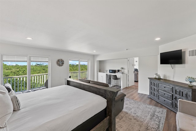 bedroom with access to exterior and wood-type flooring