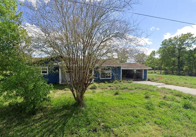 single story home featuring a carport