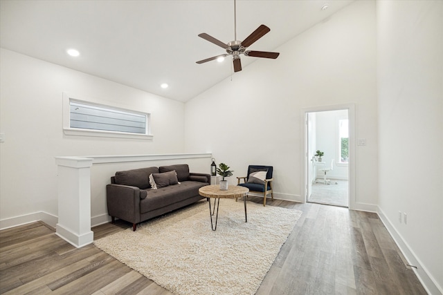 living room with high vaulted ceiling, wood-type flooring, and ceiling fan