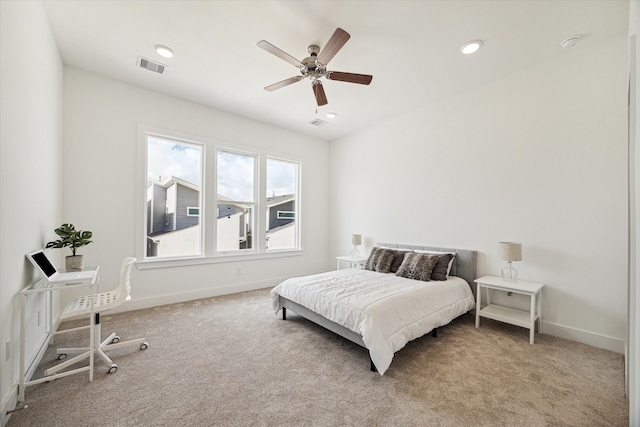 carpeted bedroom with ceiling fan