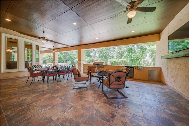 exterior space featuring ceiling fan and wooden ceiling