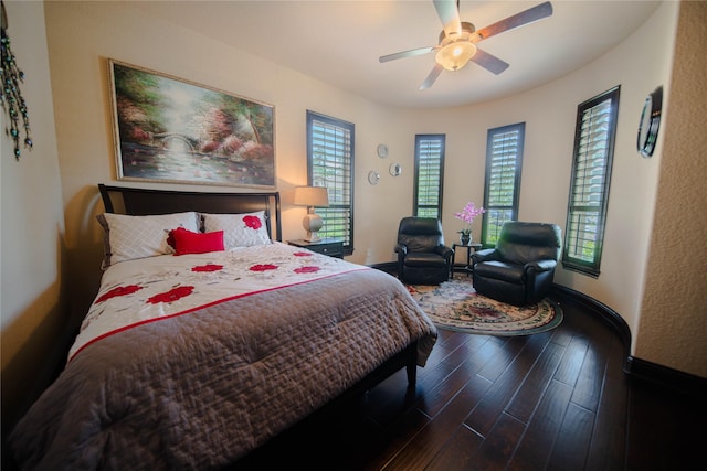 bedroom with ceiling fan and dark hardwood / wood-style flooring