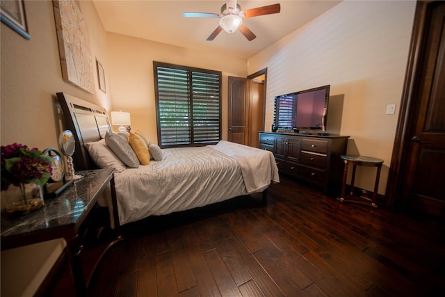 bedroom with ceiling fan and dark hardwood / wood-style floors