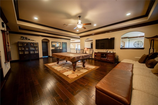 playroom with ceiling fan, dark wood-type flooring, a raised ceiling, billiards, and crown molding