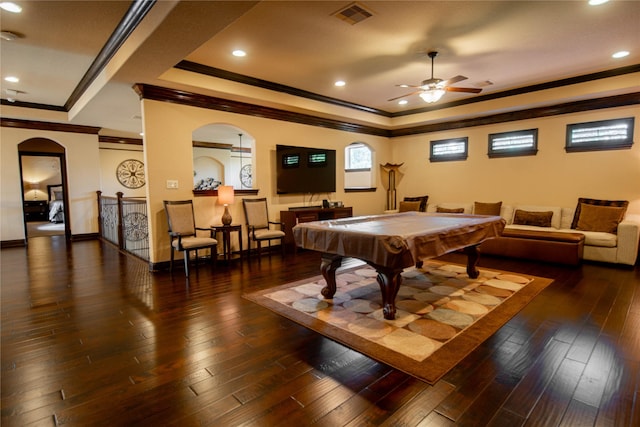 rec room featuring a raised ceiling, crown molding, dark wood-type flooring, and pool table