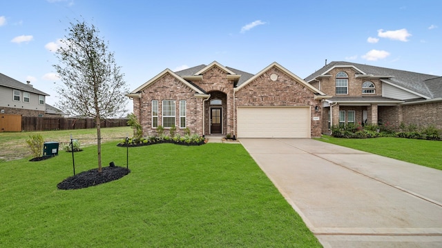 craftsman inspired home featuring a garage and a front lawn