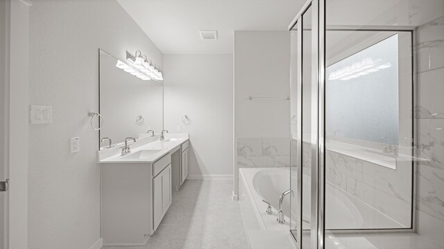 bathroom featuring tile patterned floors, vanity, and plus walk in shower