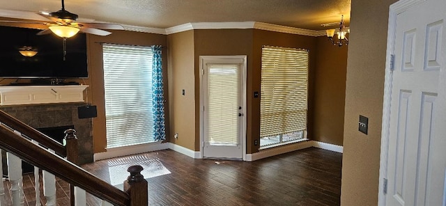 doorway to outside with ornamental molding, a healthy amount of sunlight, and dark wood-type flooring