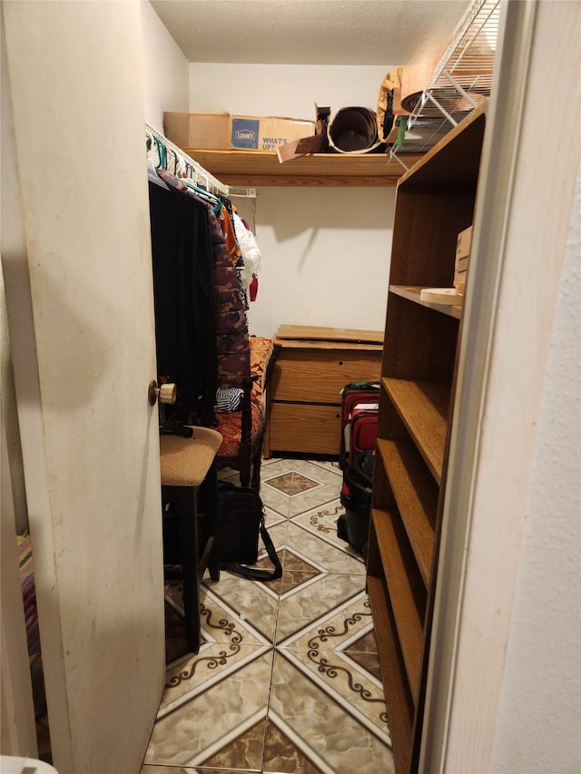 spacious closet featuring tile patterned floors