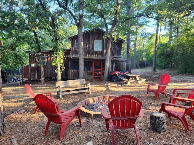 exterior space with a fire pit