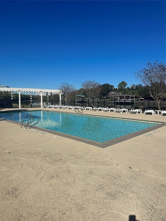 view of swimming pool featuring a patio area