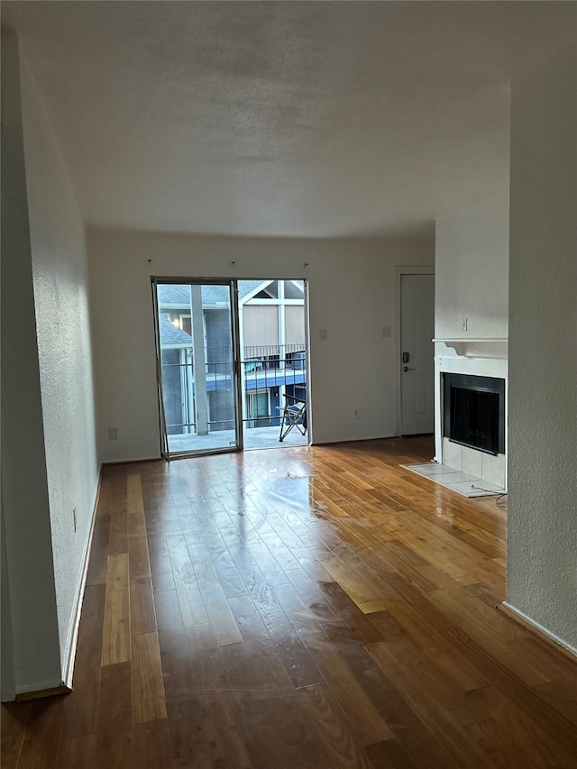 unfurnished living room featuring wood-type flooring