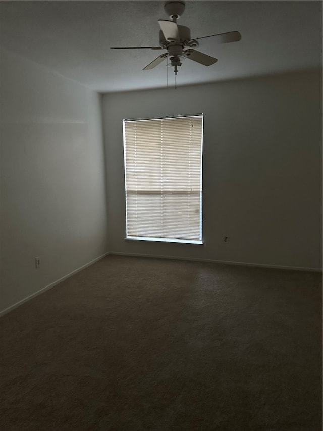 spare room with ceiling fan and carpet floors