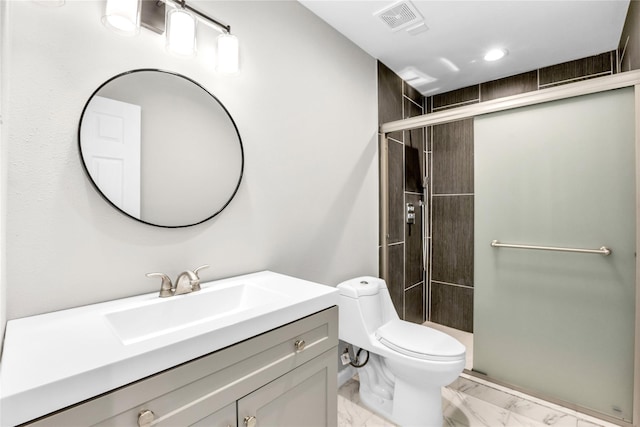 bathroom featuring vanity, toilet, and walk in shower