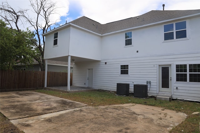 back of house with a patio area and central air condition unit