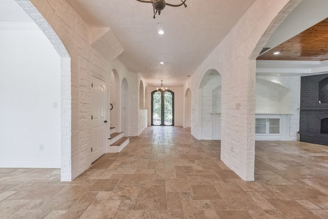 tiled entryway with a textured ceiling