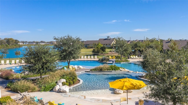 view of property's community featuring a patio area and a pool