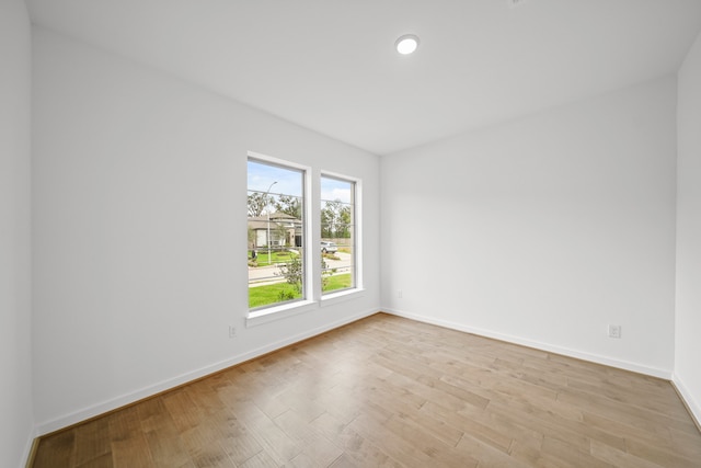 unfurnished room featuring light wood-type flooring